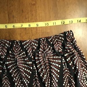 Print a multi color skirt black red and white.